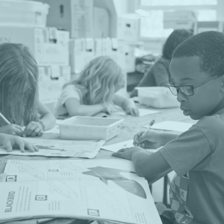 Children sitting at a table in school classroom