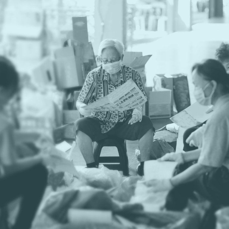 Blue overtoned image with people sitting together