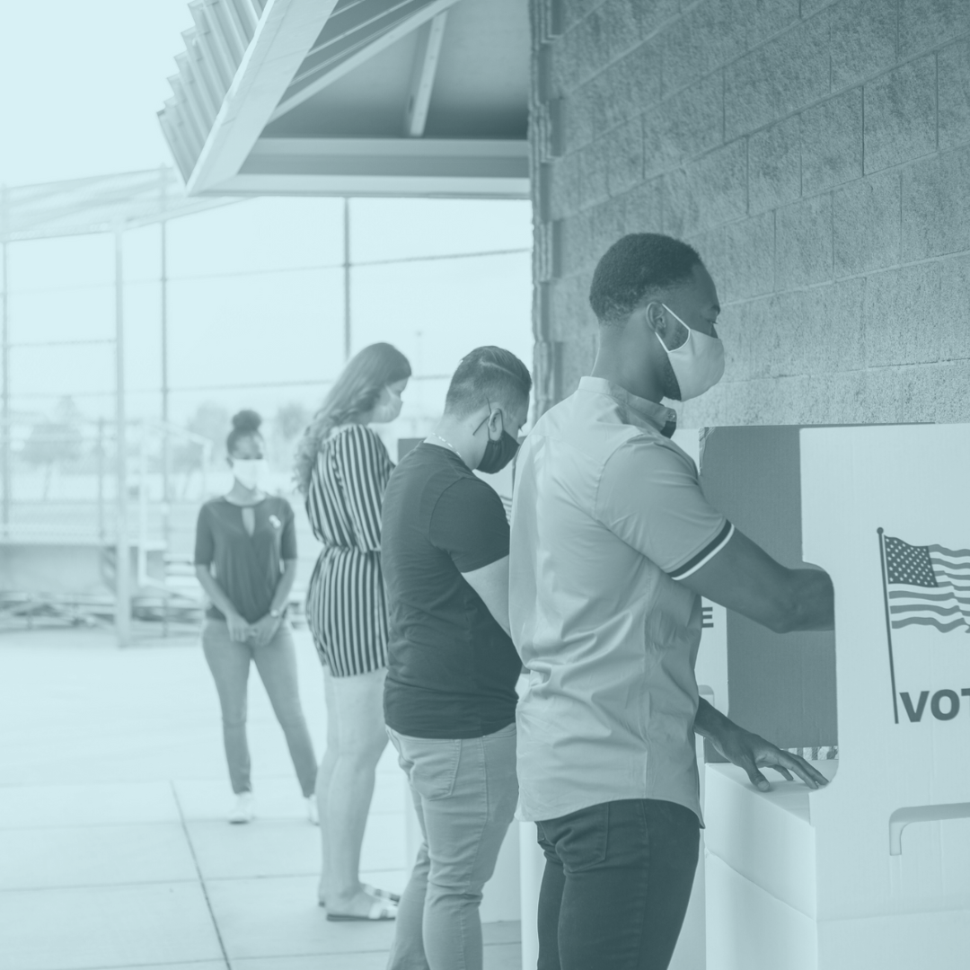 Elections photo of people standing a voting kiosks