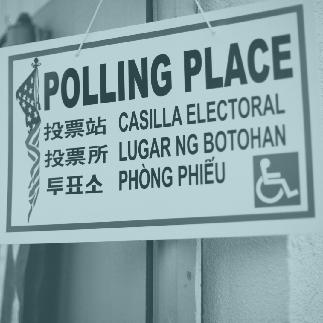 Elections photo of a sign for a polling place shows translations and accessibility