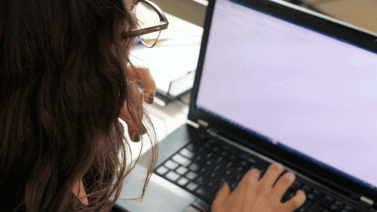 series of videos from a person typing, to a printer, to mailing letters, to a person reading their mail